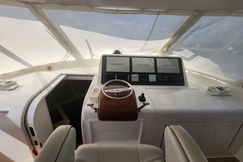 Slide: The Image of Helm of 2018 Viking 48 Sport Tower with Garmin navigation displays. - 19