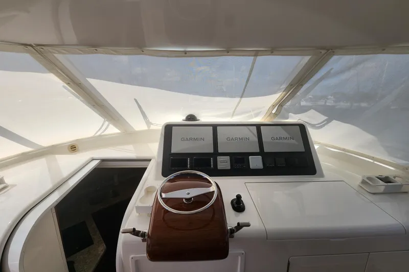 Slide: The Image of Helm of 2018 Viking 48 Sport Tower with Garmin navigation displays. - 21