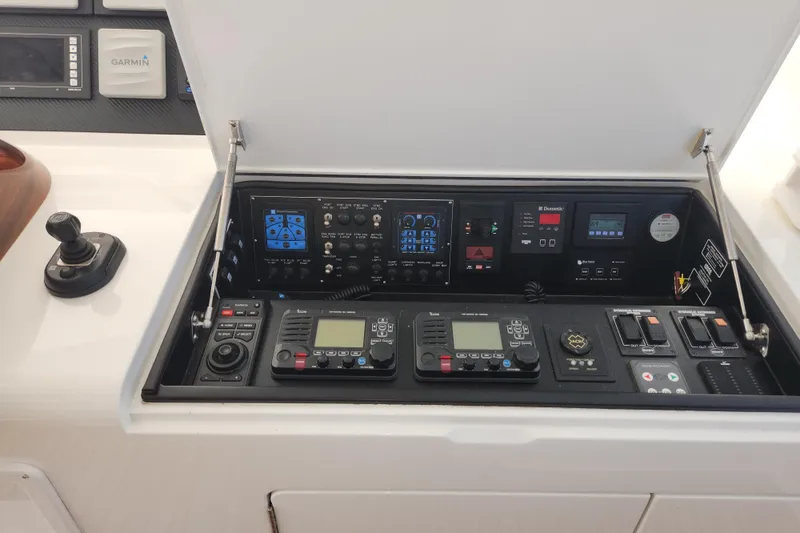 Slide: The Image of Control panel of a 2018 Viking 48 Sport Tower yacht with navigation and communication equipment. - 23