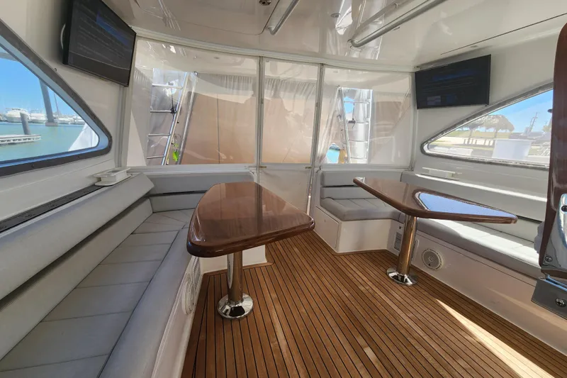 Slide: The Image of Luxurious interior of 2018 Viking 48 Sport Tower yacht with wooden flooring and seating. - 34