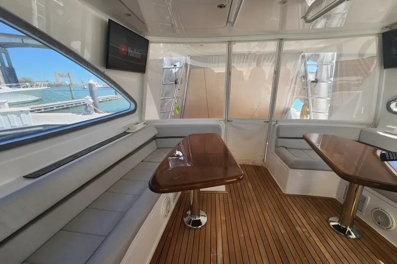 Slide: The Image of Luxurious interior of 2018 Viking 48 Sport Tower yacht with wooden flooring and seating. - 36
