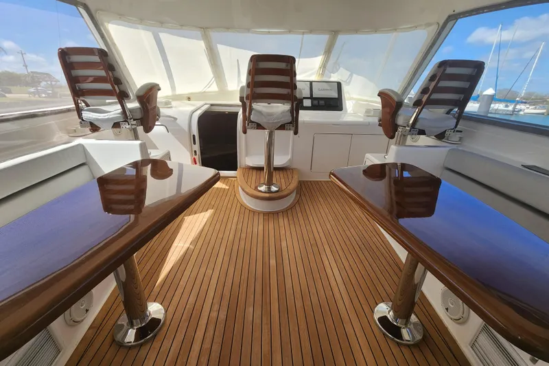 Slide: The Image of Luxurious interior of 2018 Viking 48 Sport Tower yacht with polished wood and seating. - 44