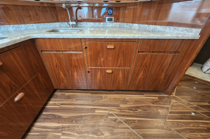 Slide: The Image of Luxurious wooden kitchen interior of 2018 Viking 48 Sport Tower yacht. - 50