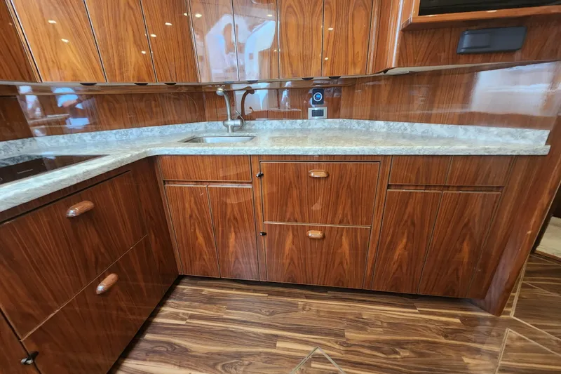 Slide: The Image of Luxurious wooden kitchen interior of 2018 Viking 48 Sport Tower yacht. - 56