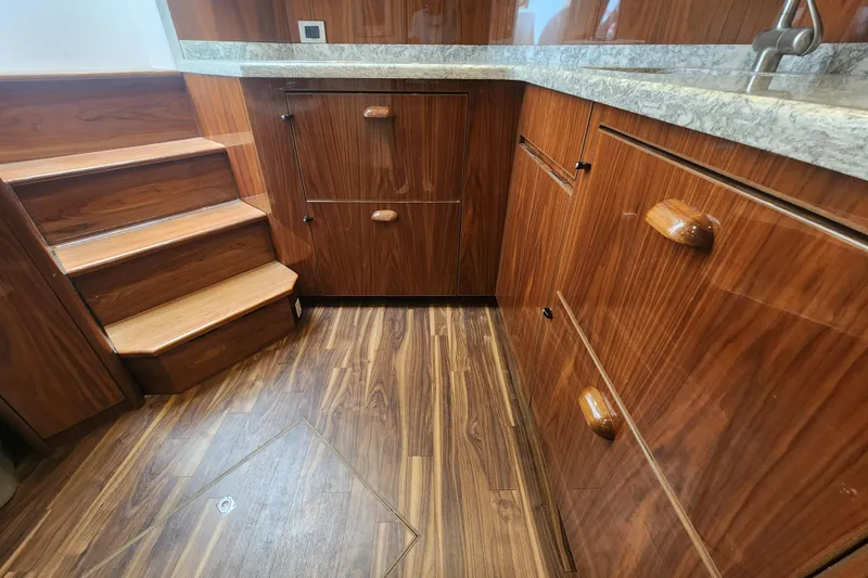Slide: The Image of Luxurious wood interior of 2018 Viking 48 Sport Tower yacht kitchen. - 57