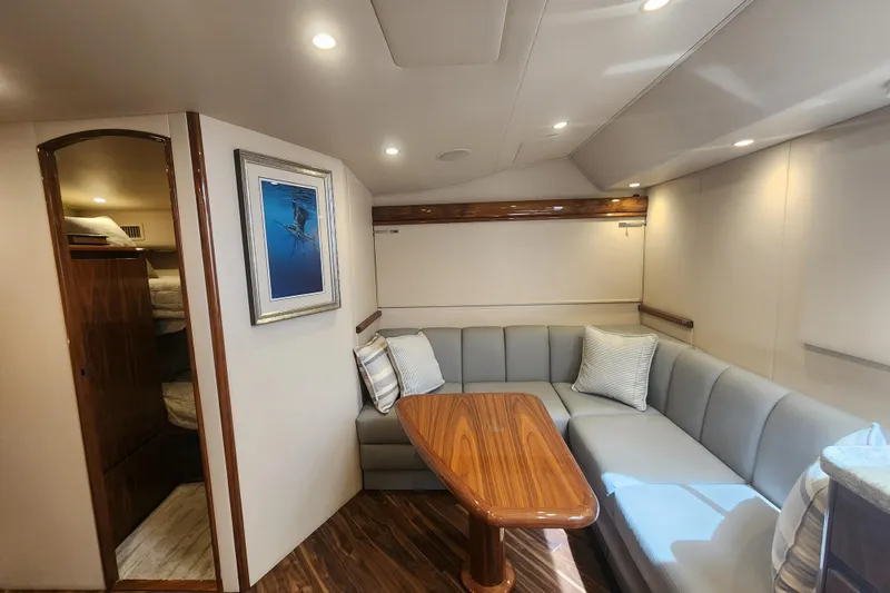 Slide: The Image of Luxurious interior of 2018 Viking 48 Sport Tower yacht with elegant seating and wooden table. - 60