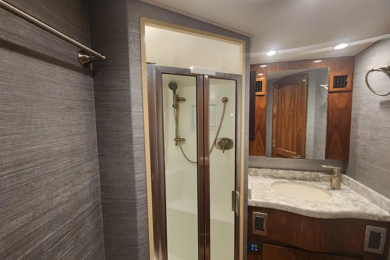 Slide: The Image of Luxurious bathroom interior of 2018 Viking 48 Sport Tower yacht with shower and vanity. - 63