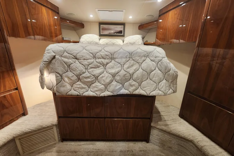 Slide: The Image of Luxurious cabin interior of 2018 Viking 48 Sport Tower with elegant wood finishes. - 72