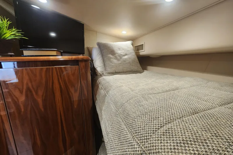Slide: The Image of Luxurious cabin interior of 2018 Viking 48 Sport Tower with cozy bed and TV. - 76