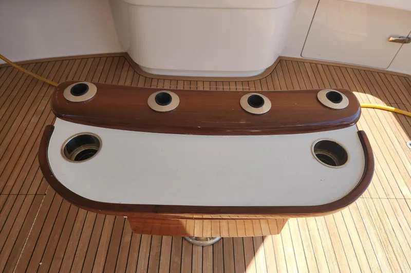 Slide: The Image of Fishing rod holders on teak deck of 2018 Viking 48 Sport Tower yacht. - 84