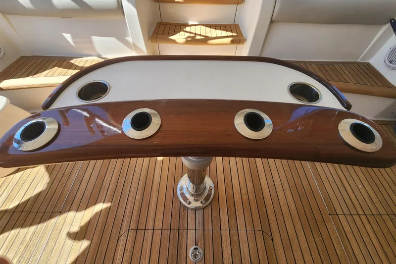 Slide: The Image of Teak deck with rod holders on a 2018 Viking 48 Sport Tower yacht. - 85