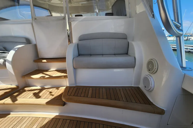 Slide: The Image of Luxurious interior of 2018 Viking 48 Sport Tower with teak steps and cushioned seating. - 88