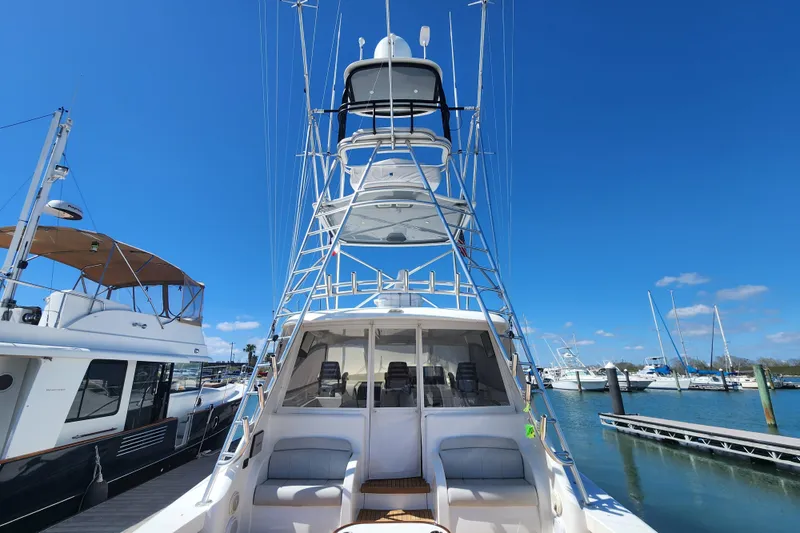 Slide: The Image of 2018 Viking 48 Sport Tower yacht docked under clear blue sky. - 98