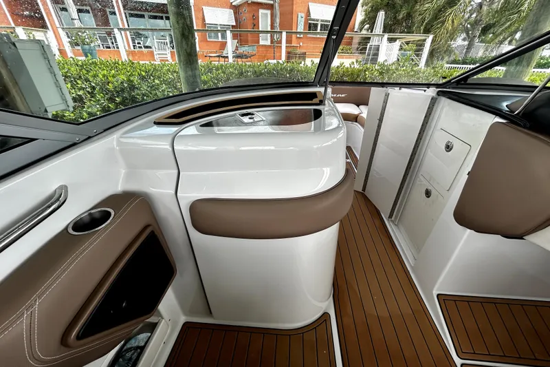 Slide: The Image of 2017 Crownline Eclipse E29 XS boat interior with sleek design and wood flooring. - 15