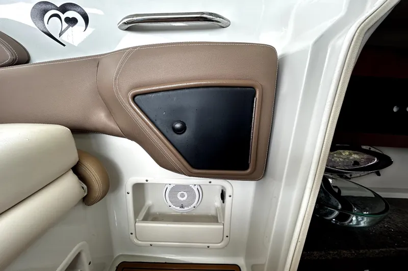 Slide: The Image of 2017 Crownline Eclipse E29 XS interior detail with speaker and storage compartment. - 17