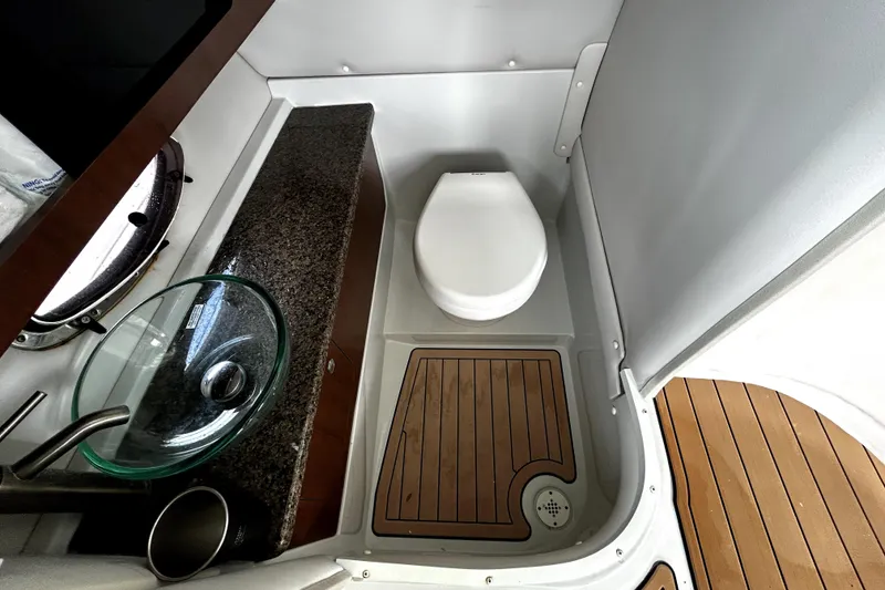 Slide: The Image of 2017 Crownline Eclipse E29 XS boat bathroom with modern sink and toilet. - 18