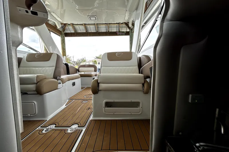 Slide: The Image of Interior of 2017 Crownline Eclipse E29 XS boat with luxurious seating and wood flooring. - 22