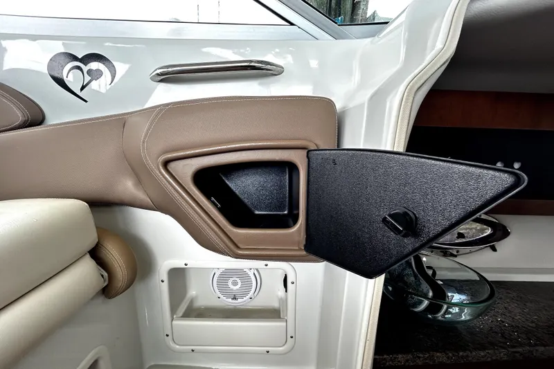 Slide: The Image of Interior of 2017 Crownline Eclipse E29 XS boat with storage compartment and speaker. - 23