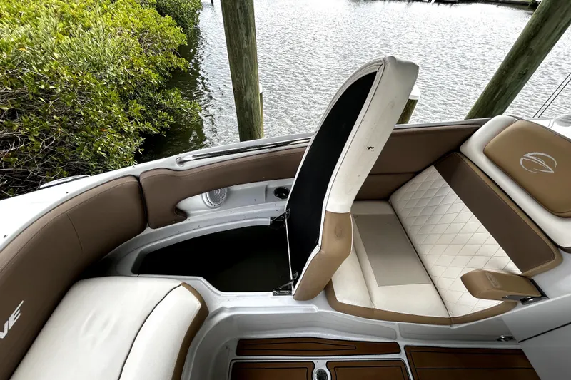 Slide: The Image of 2017 Crownline Eclipse E29 XS boat interior with tan and white seating. - 24
