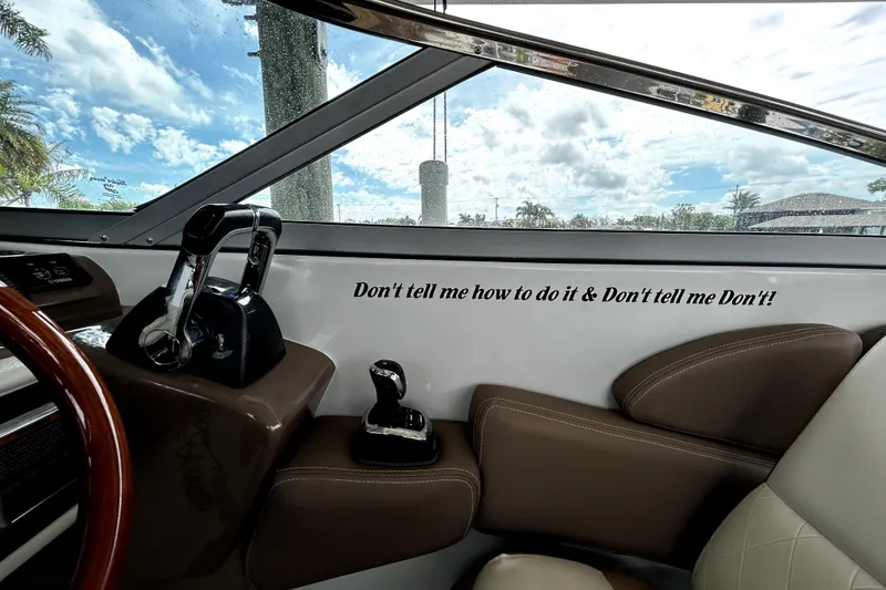 Slide: The Image of 2017 Crownline Eclipse E29 XS boat interior with motivational quote on dashboard. - 27