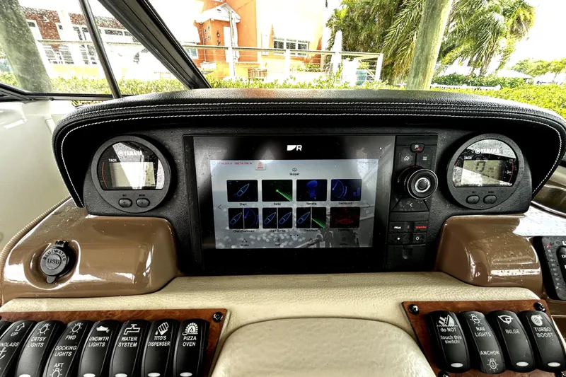 Slide: The Image of Dashboard of 2017 Crownline Eclipse E29 XS boat with digital display and controls. - 29