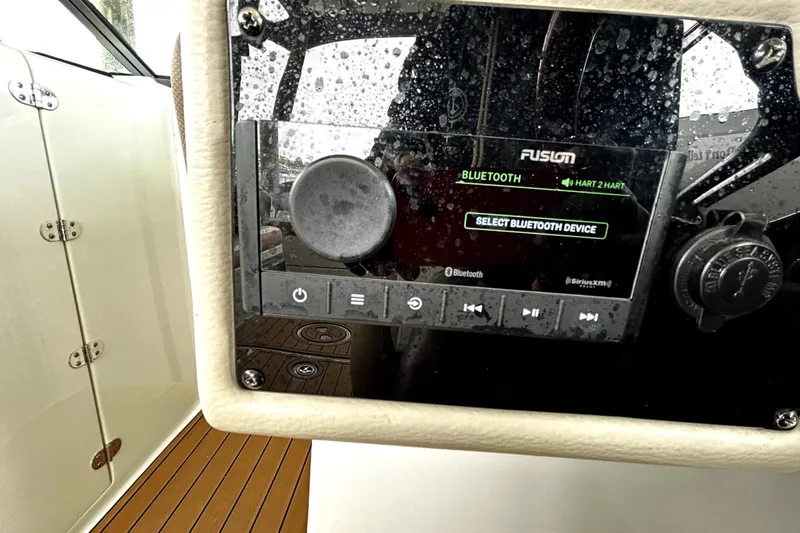 Slide: The Image of Control panel of a 2017 Crownline Eclipse E29 XS boat with Bluetooth connectivity. - 31