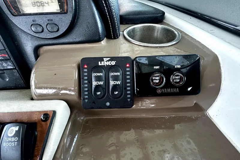 Slide: The Image of Control panel of a 2017 Crownline Eclipse E29 XS boat with Lenco and Yamaha controls. - 32