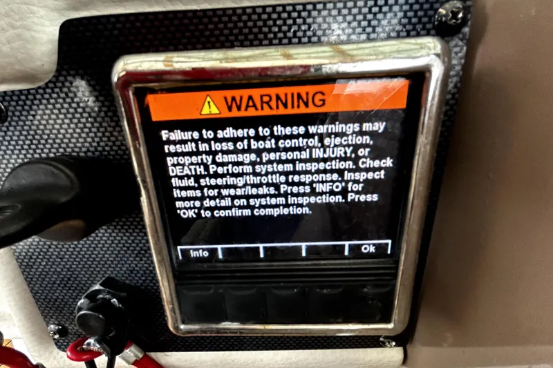 Slide: The Image of Warning display on 2017 Crownline Eclipse E29 XS boat control panel. - 35