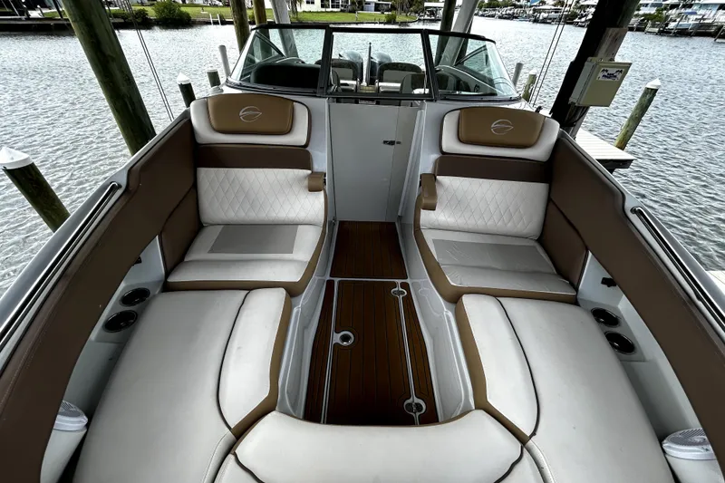 Slide: The Image of Interior of 2017 Crownline Eclipse E29 XS boat with luxurious seating and wood flooring. - 37