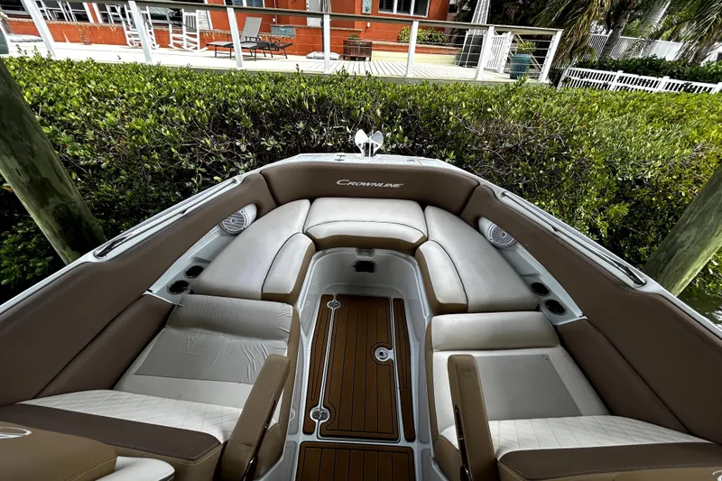 Slide: The Image of 2017 Crownline Eclipse E29 XS boat interior with tan seating and wood flooring. - 38