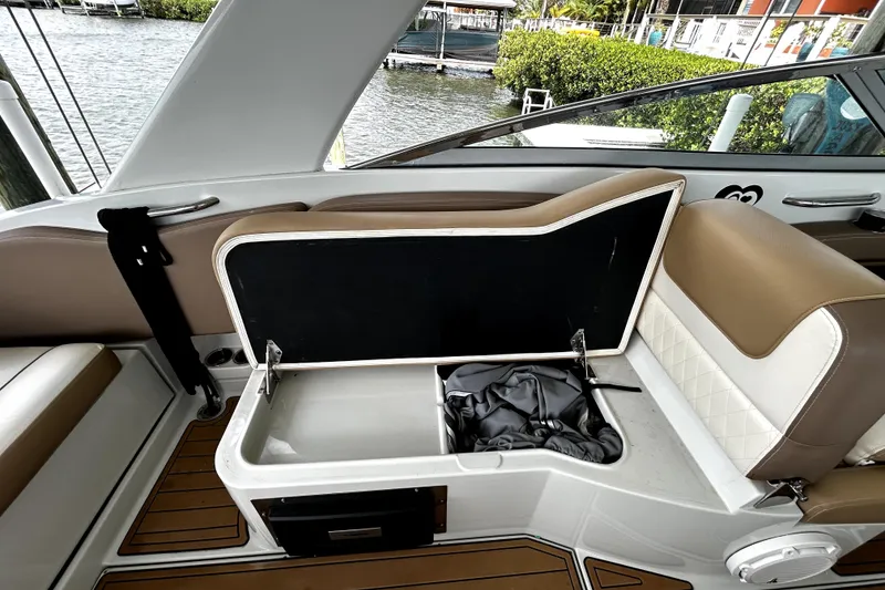 Slide: The Image of 2017 Crownline Eclipse E29 XS boat interior with open storage compartment and seating. - 41