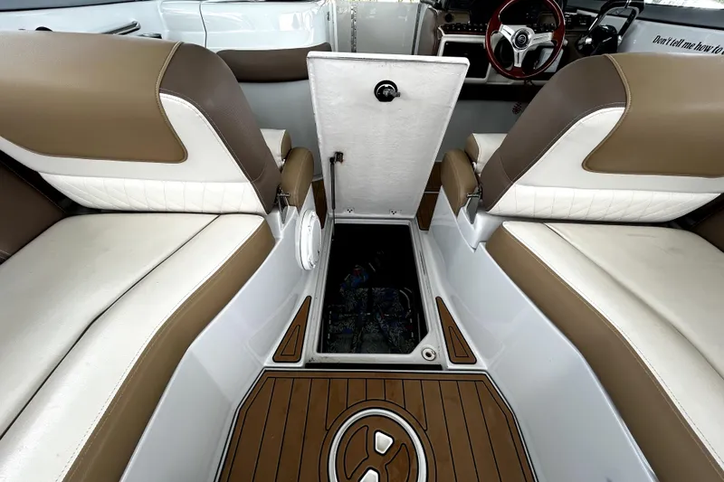Slide: The Image of 2017 Crownline Eclipse E29 XS boat interior with open storage compartment. - 45