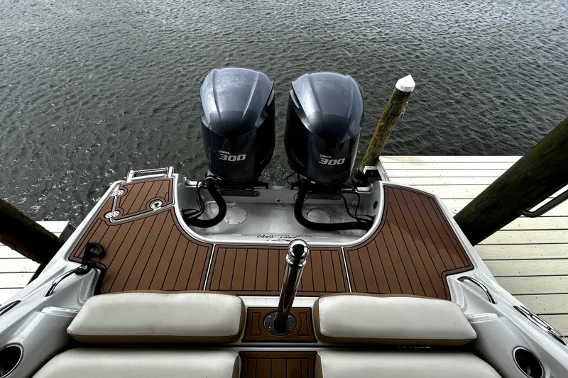 Slide: The Image of 2017 Crownline Eclipse E29 XS boat with twin Yamaha 300 engines at dock. - 49