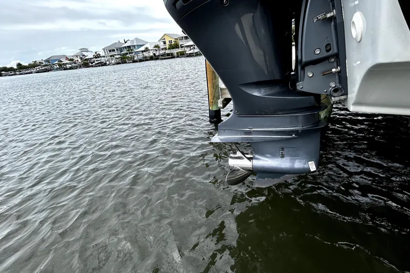 Slide: The Image of Outboard motor of 2017 Crownline Eclipse E29 XS on calm water. - 51