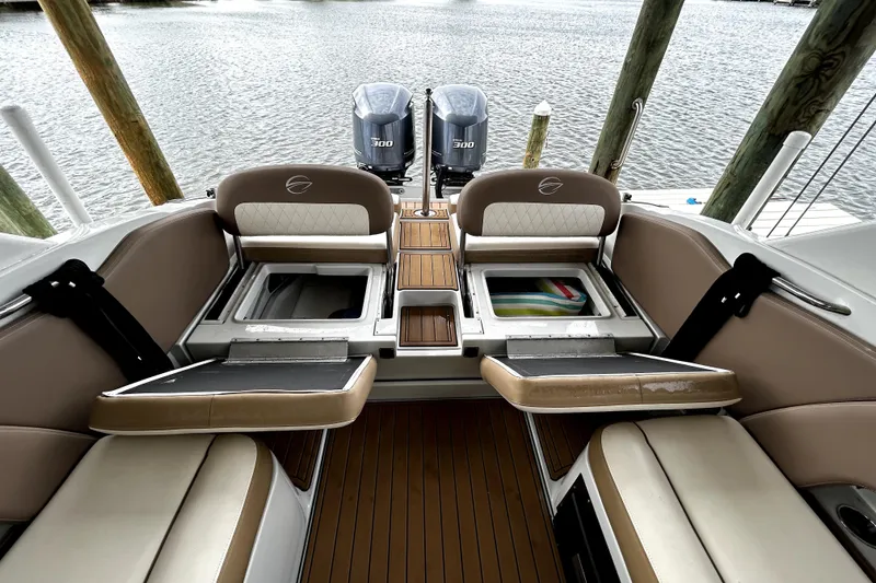 Slide: The Image of 2017 Crownline Eclipse E29 XS boat interior with seating and storage compartments. - 56