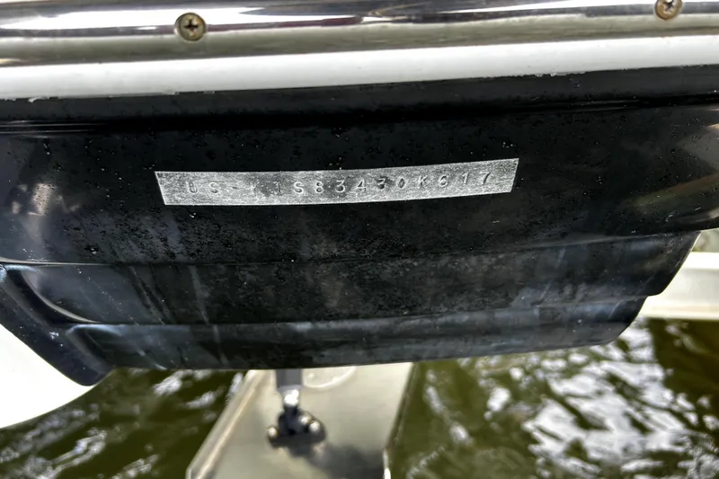 Slide: The Image of 2017 Crownline Eclipse E29 XS boat hull identification number on black surface. - 60