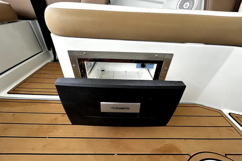 Slide: The Image of 2017 Crownline Eclipse E29 XS boat with Dometic cooler on teak deck. - 62