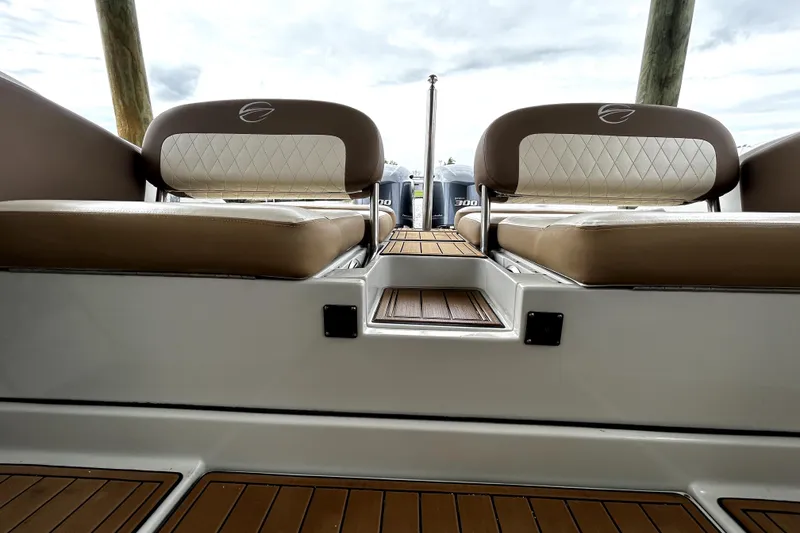Slide: The Image of 2017 Crownline Eclipse E29 XS boat interior with cushioned seating and teak flooring. - 63