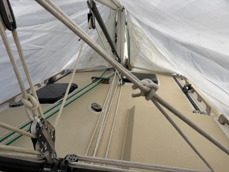 Slide: The Image of Interior view of a 1985 Benford 39 sailboat with ropes and cover. - 11