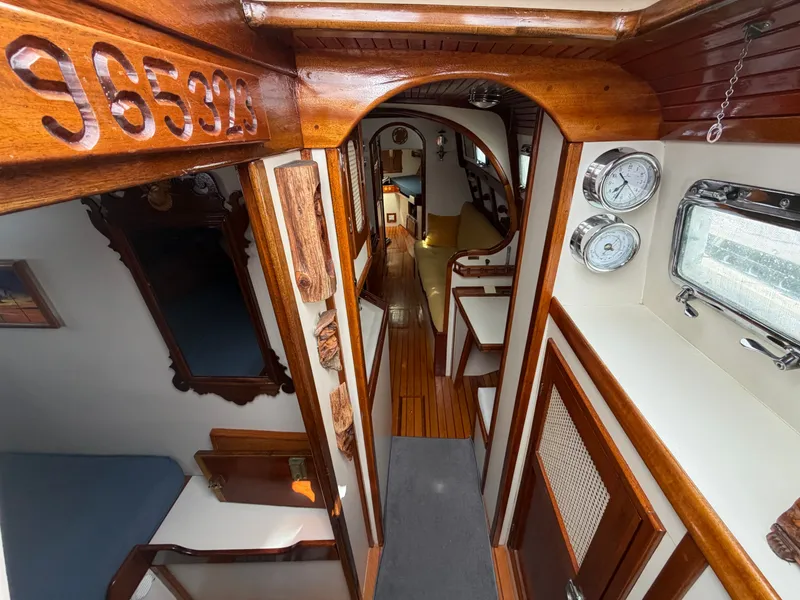 Slide: The Image of Interior of a 1985 Benford 39 yacht with wooden finish. - 12