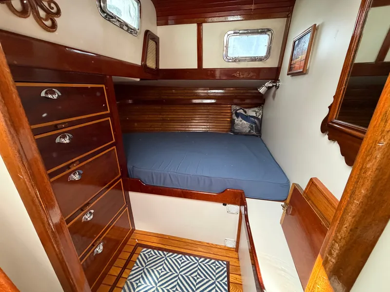 Slide: The Image of Interior of a 1985 Benford 39 yacht with wooden furnishings. - 13