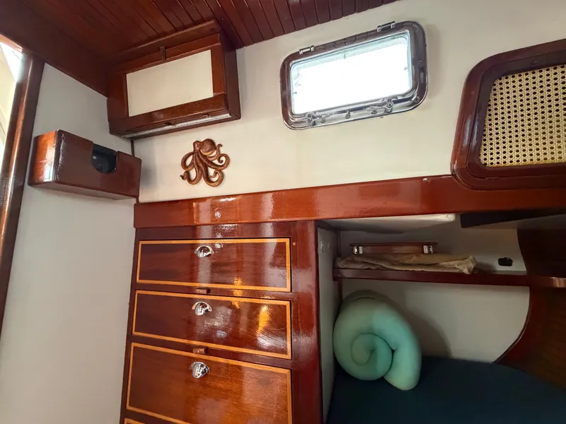 Slide: The Image of Interior of a 1985 Benford 39 yacht with wooden furnishings. - 16
