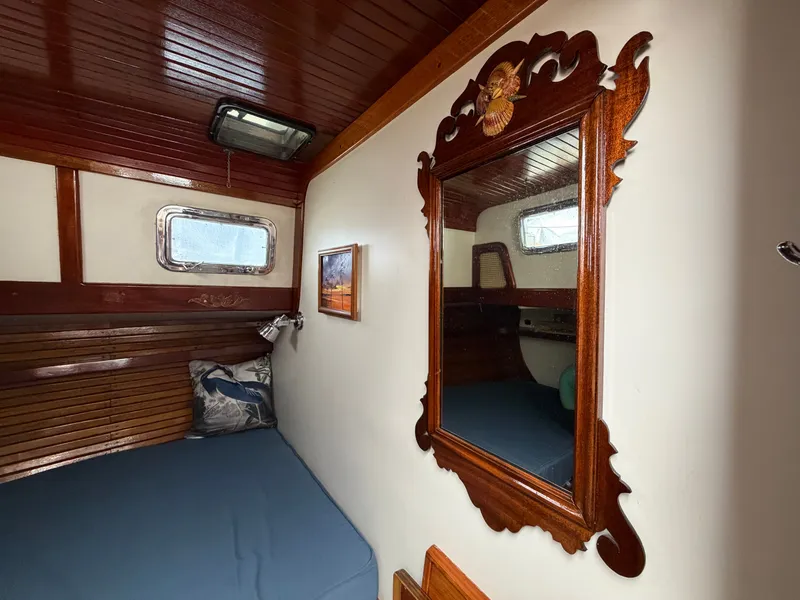 Slide: The Image of Interior of a 1985 Benford 39 yacht with wooden paneling. - 17