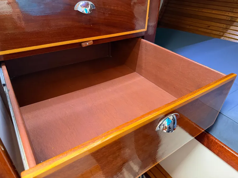 Slide: The Image of Open wooden drawer in a 1985 Benford 39 yacht. - 19