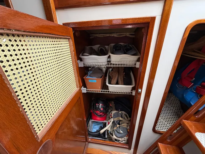 Slide: The Image of Shoe storage in a 1985 Benford 39 yacht. - 24