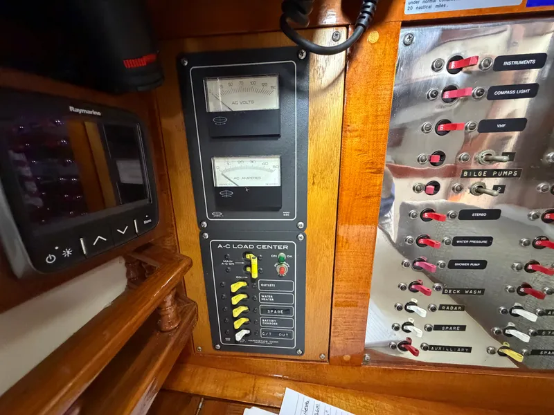 Slide: The Image of Benford 39 boat control panel with switches and gauges, year 1985. - 33