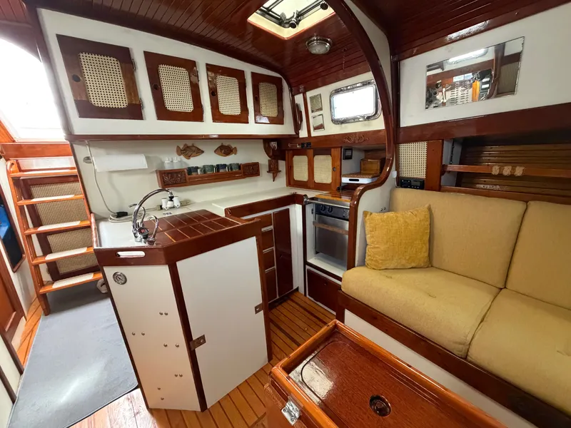 Slide: The Image of Interior of a 1985 Benford 39 yacht with wooden furnishings. - 40
