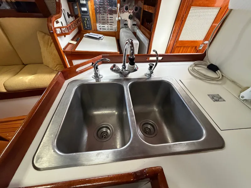 Slide: The Image of Double stainless steel sink in the galley of a 1985 Benford 39 yacht. - 42