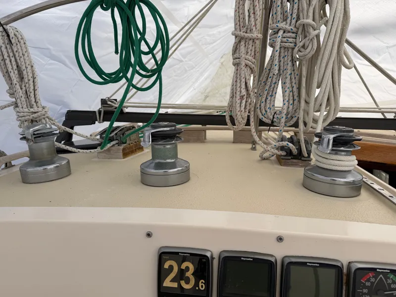 Slide: The Image of 1985 Benford 39 sailboat with winches and ropes. - 9