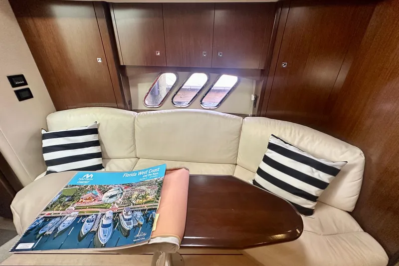 Slide: The Image of Luxurious interior of 2011 Cruisers Yachts 420 Sports Coupe with plush seating and nautical decor. - 17